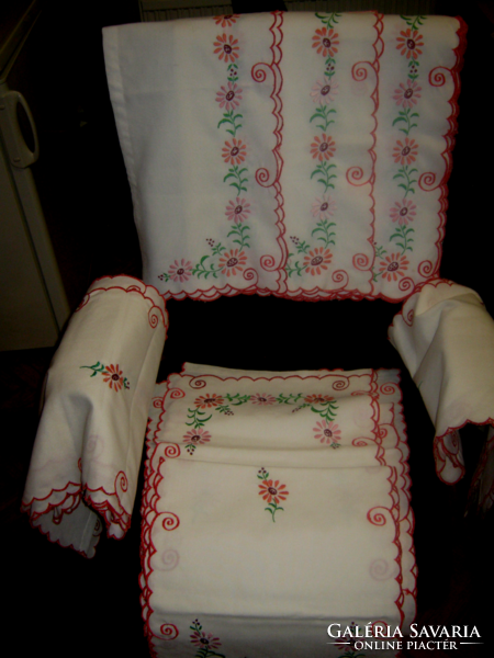3-part embroidered drapery towards and next to the door