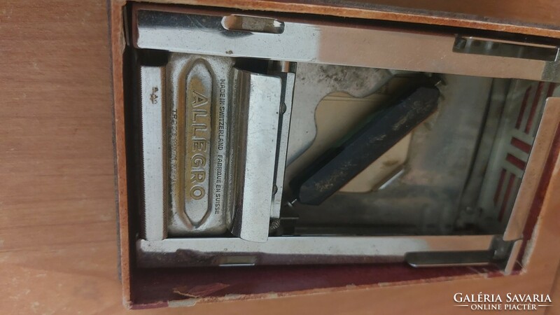 (K) Swiss Allegro razor sharpener with papers.