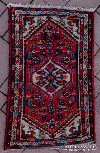 An old hand-knotted oriental wool rug with beautiful colors
