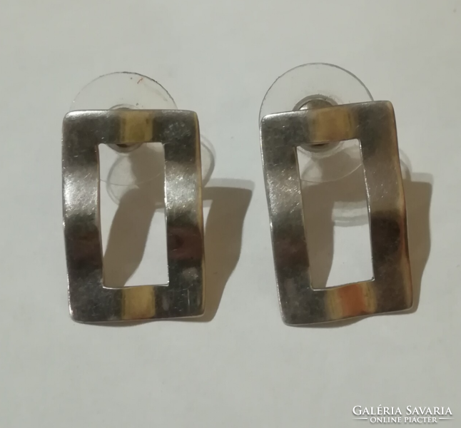 Silver earrings with several markings