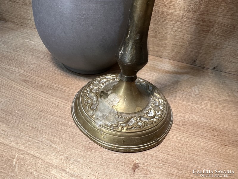 Old Russian three-pronged candle holder with a very patina