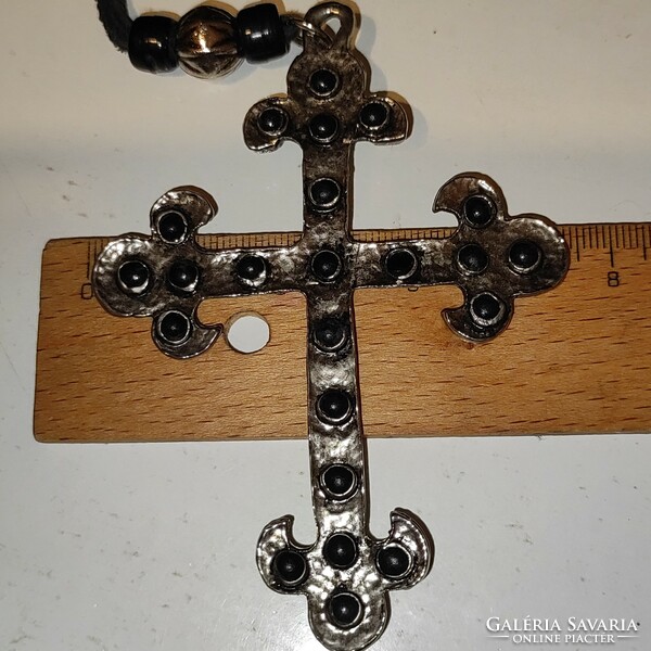 Beautiful metal crucifix on split leather