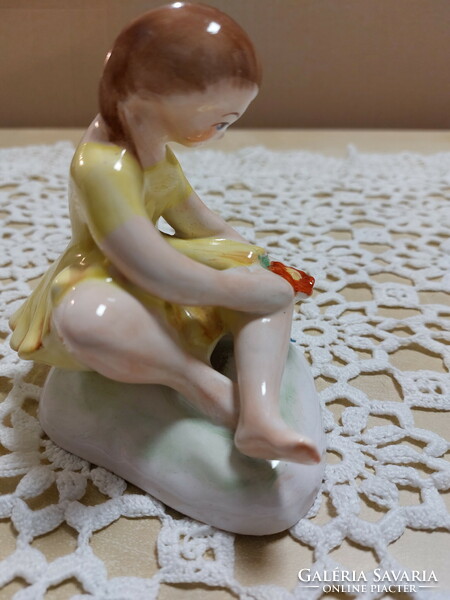 Bodrogkeresztúr porcelain figurine, a girl in a yellow dress with a flower