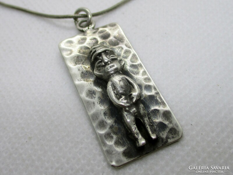 Special old handmade Mayan silver pendant on a silver necklace