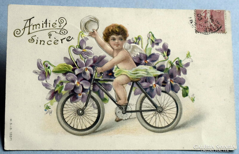 Antique embossed greeting litho postcard - cycling angel violet