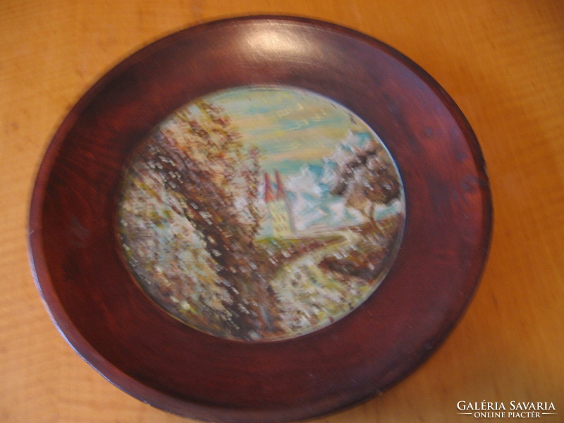 Painted snowy landscape on a wooden plate