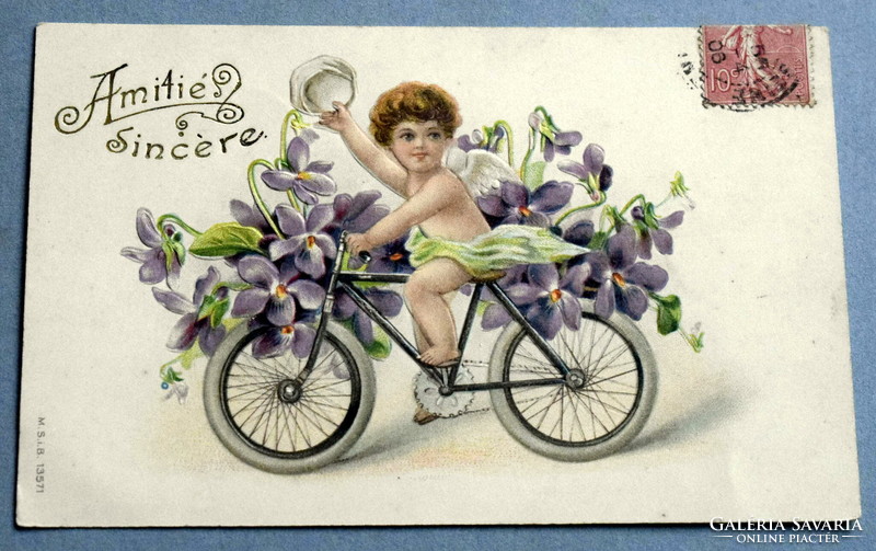 Antik dombornyomott üdvözlő litho képeslap -  kerékpározó angyalka  ibolya
