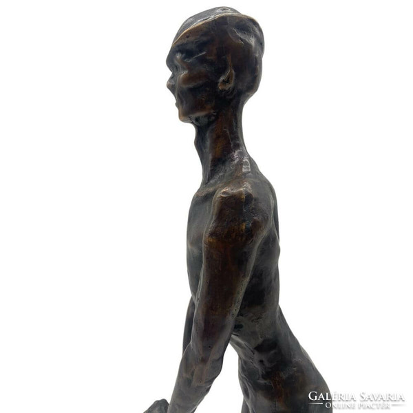Bronze sculpture on a marble plinth - resting man m01162