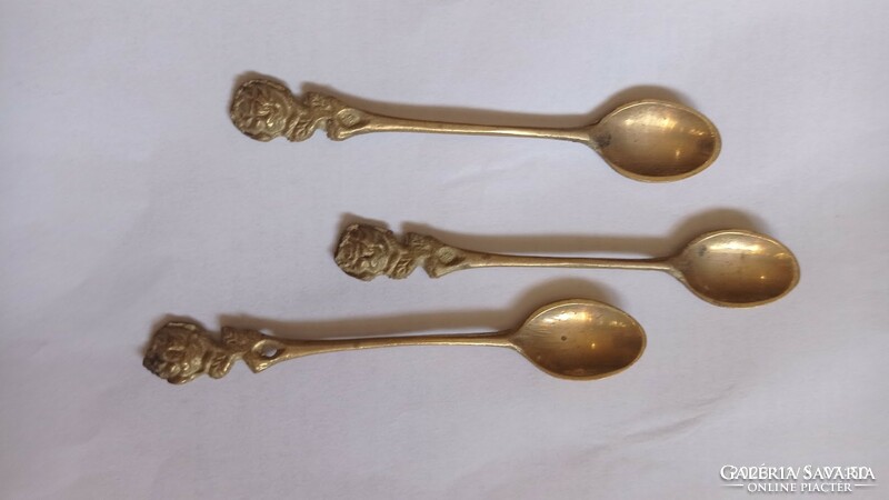 Three antique copper spoons
