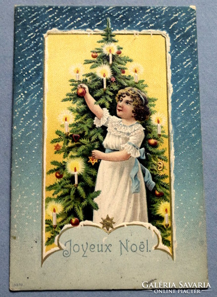 Antique embossed Christmas greeting card - little girl decorating a Christmas tree from 1907