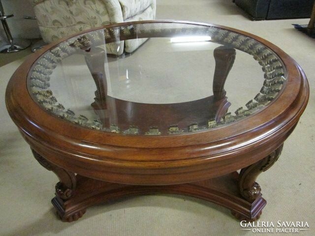 Colonial style coffee table with a large glass top, manufactured by American ashley.