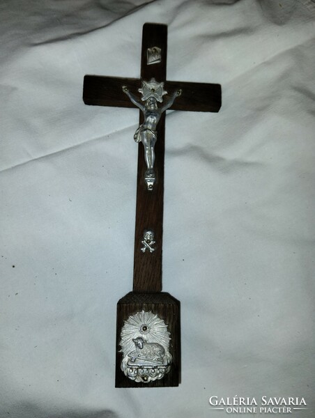 Wooden cross with metal body