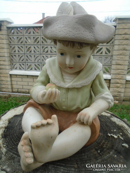 Large porcelain German Bavarian boy with an apple in his hand with two minor flaws, very nice