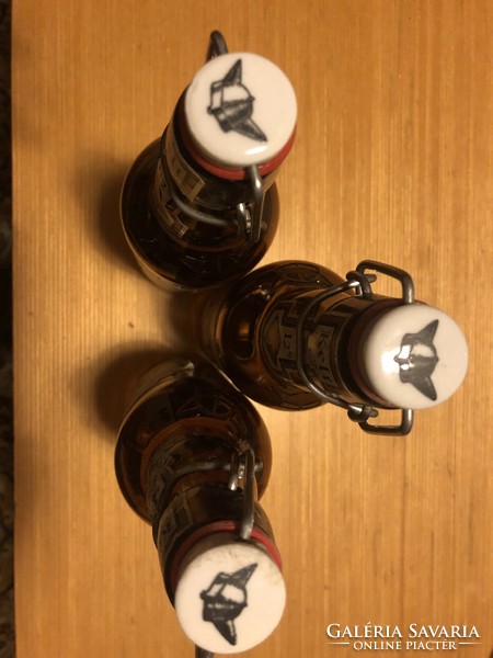 3 beer bottles with buckles