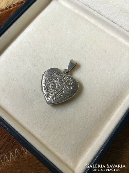 Old silver heart-shaped photo pendant