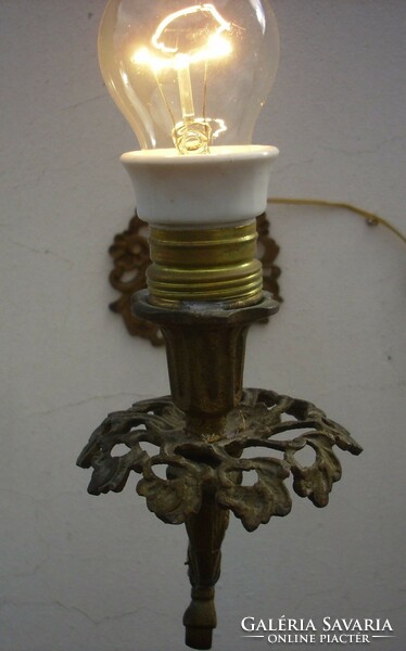 It was an antique 200-year-old wall arm with a candle holder
