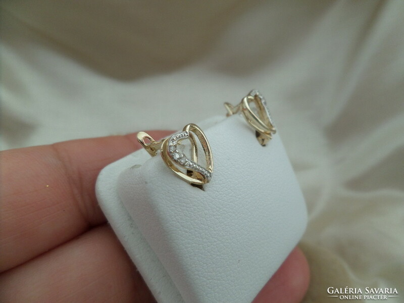 Gold heart earrings with a couple of small diamonds