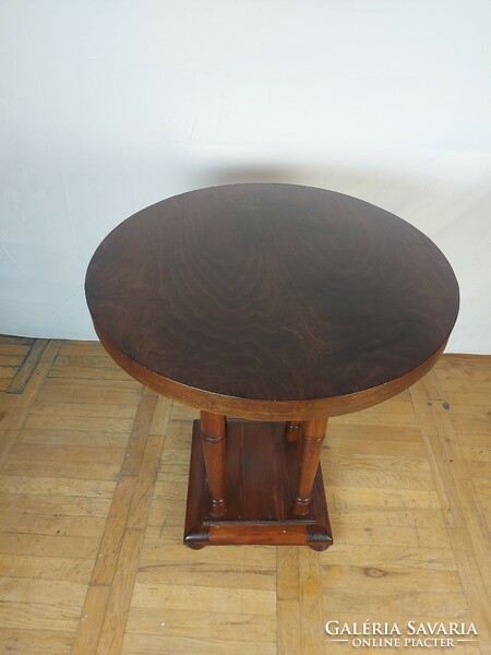 Art Nouveau round table with storage