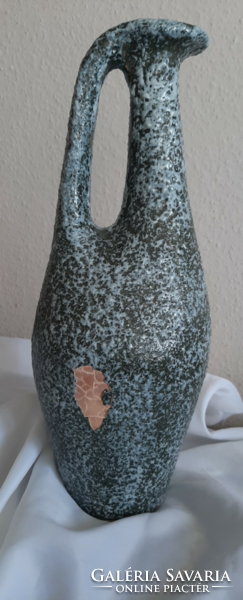 A large retro ceramic vase with a wonderful shape is probably from a plague cold well