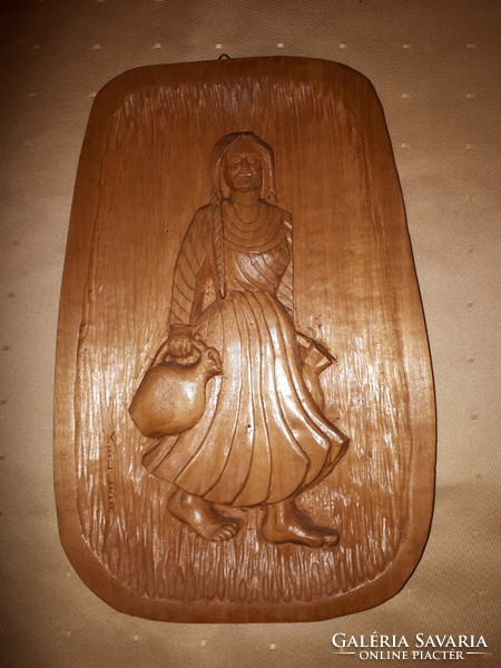 Hand-carved wooden plaque Girl with pitcher