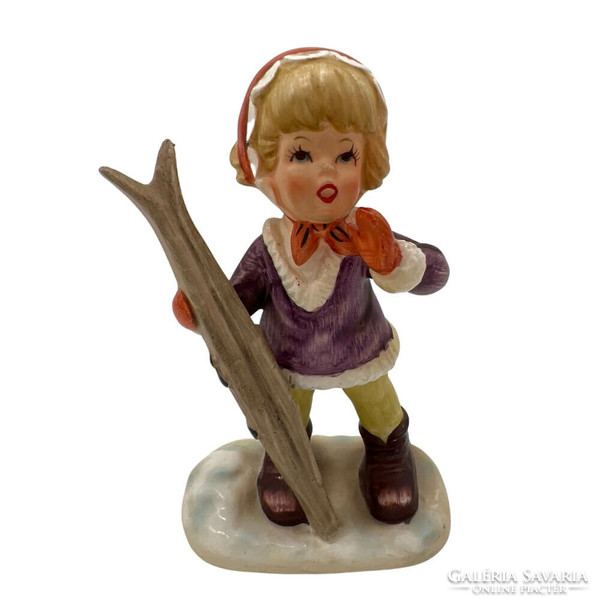 Little girl with porcelain skis m00710
