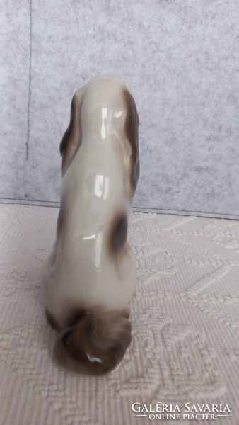 Ravenclaw porcelain sitting dog, marked, 14.5 x 12.3 x 5.5 cm