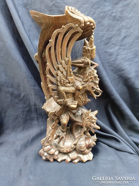 Balinese wood carving, bird of god Garuda-Vishnu from Hindu mythology.