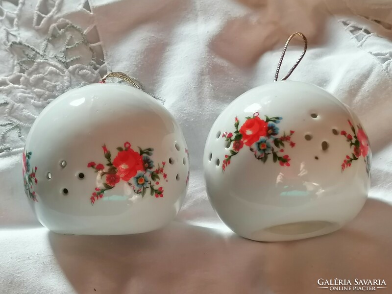 Pair of porcelain flowery, decorative perfume balls.