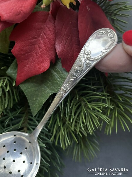 Old, silver-plated icing sugar spoon with a nice pattern