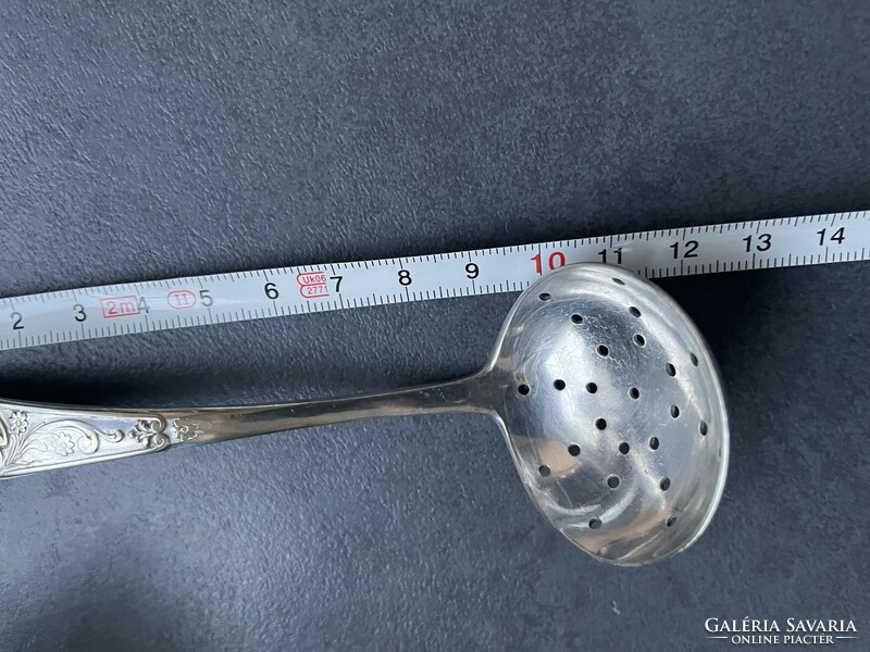 Old, silver-plated icing sugar spoon with a nice pattern