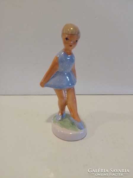 Ceramic little girl in a turquoise blue dress