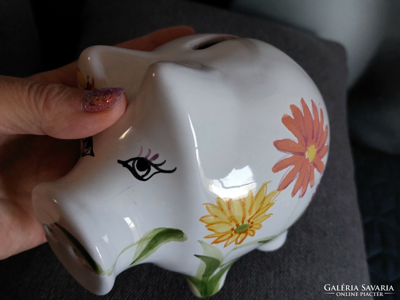 Glazed ceramic piggy bank with flower pattern