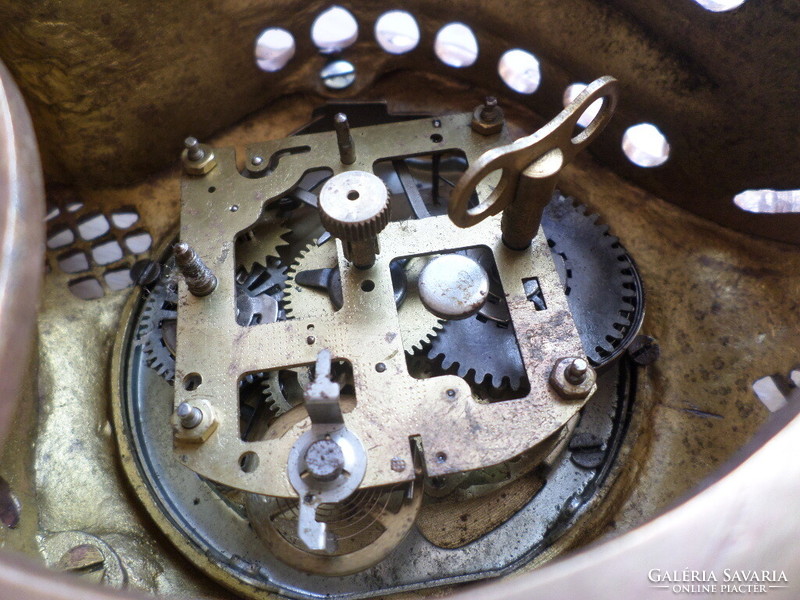 Old copper decorative Rococo fireplace clock with mechanical clock mechanism