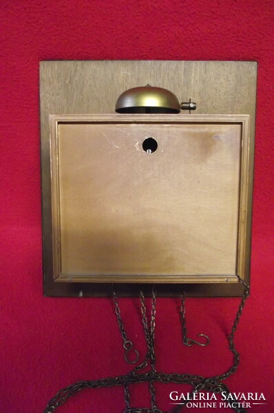 Two-weight wall clock with copper dial.