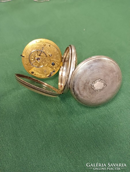 An English silver pocket watch from 1849 with a key