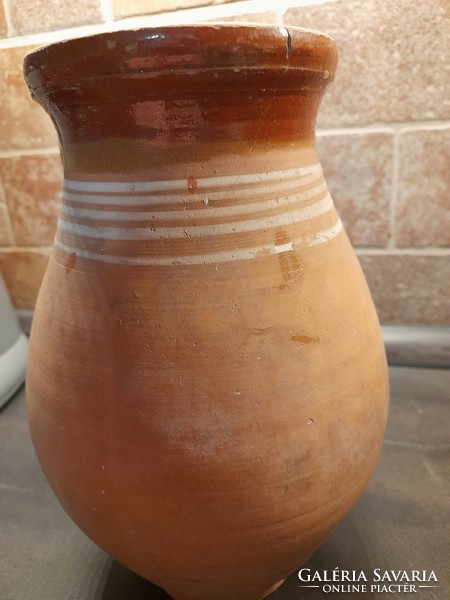 Traditional earthenware pot with striped decoration and glazed inside