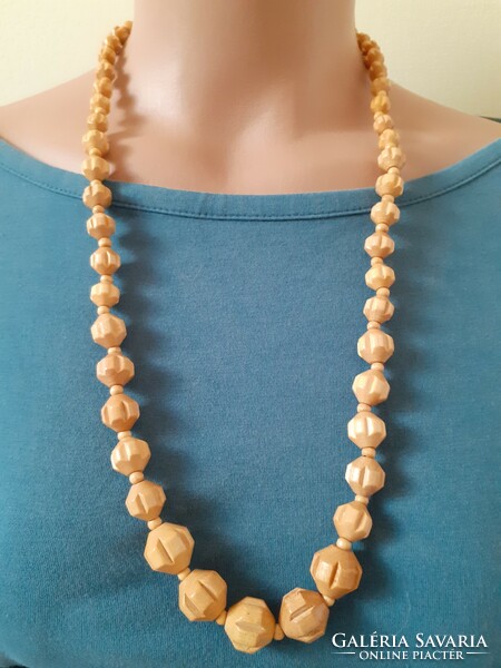 Older plastic necklace with decreasing links