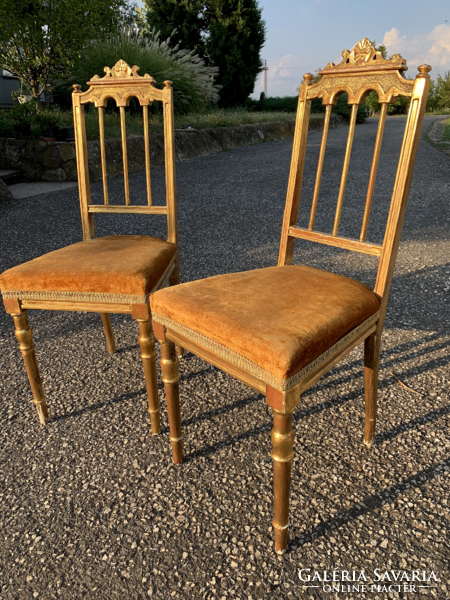 xvi. A pair of Louis-style French gilded chairs