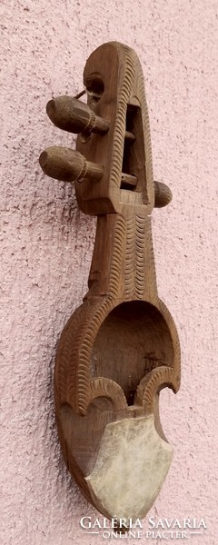 Shell violin, or rebab, a short-necked stringed instrument. With leather resonator