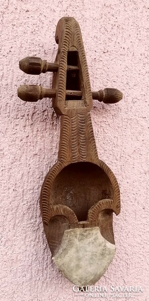 Shell violin, or rebab, a short-necked stringed instrument. With leather resonator