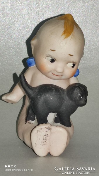 Antique kepwie doll damaged marked with a black cat
