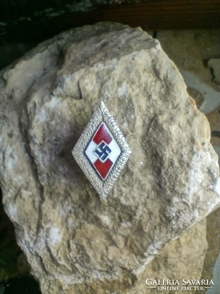 Hitler Youth enamel badge with oak leaves is rarer
