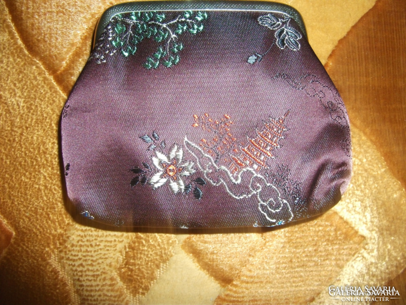 A small purse in a silk women's casual bag was not used