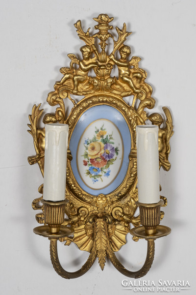 Neo-baroque gilded wall arm paired with porcelain insert
