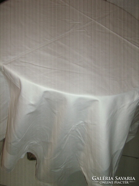 Beautiful antique white damask tablecloth with bourbon-lily corners
