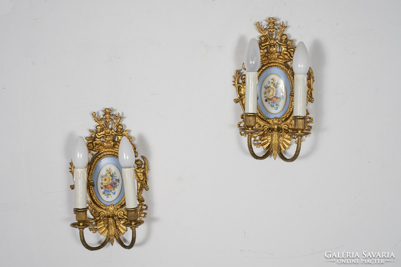 Neo-baroque gilded wall arm paired with porcelain insert