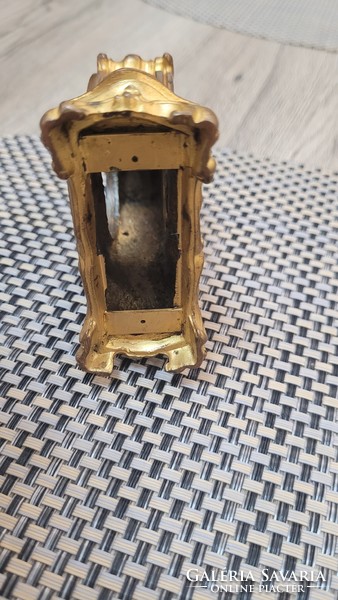 Antique copper or bronze watch case.