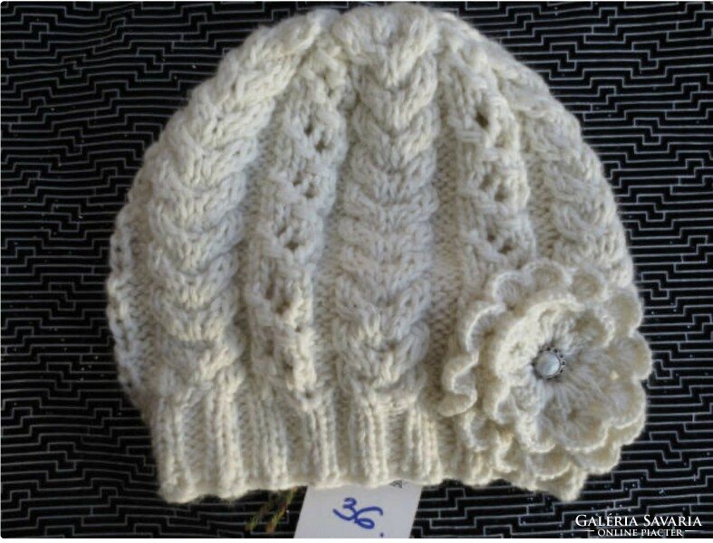 Hand-knitted women's hat with flowers