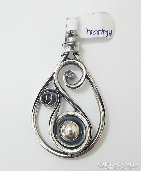 Silver pendant handmade, antiqued, bent