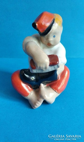 Ceramic figurine of a military soldier peeling hops